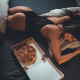 top view, tanned, ass, in bed, pizza, black lingerie, pillow, back wallpaper