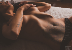lying on back, closed eyes, topless, strategic covering, tanned, tattoo, panties. belly wallpaper