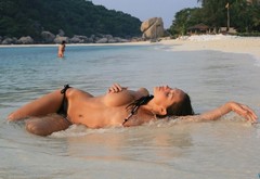 girl, laying, sea, sand, beach wallpaper